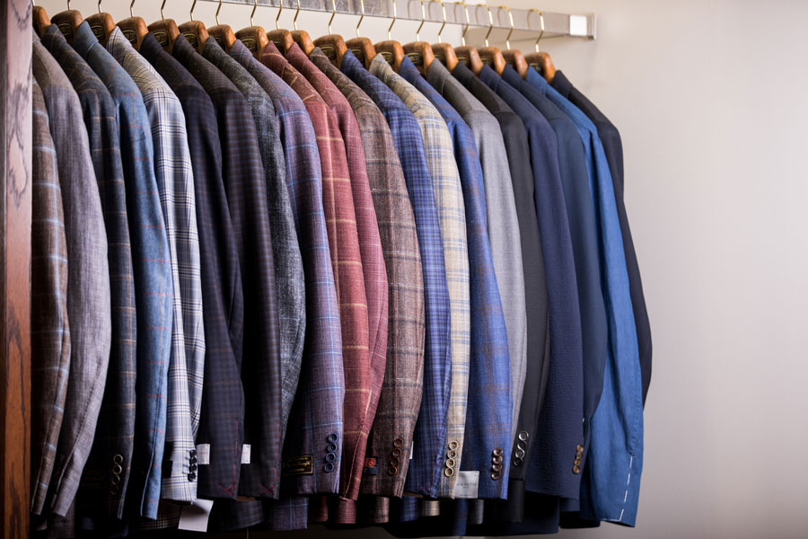 Tailored and Custom - suits hanging